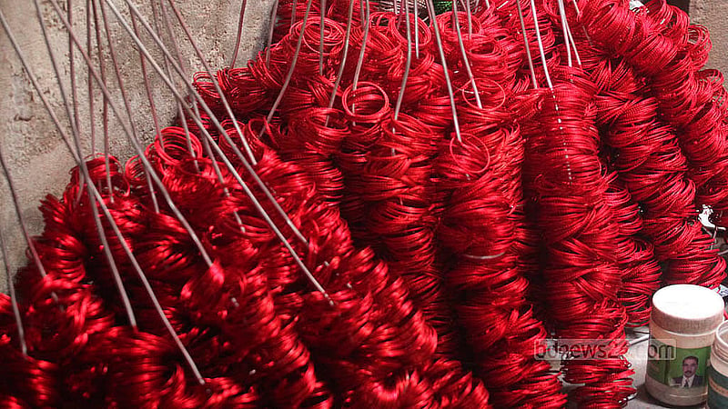 Silver bangles are dyed and dried in factories in Dhaka’s Lalbagh. Photo: Abdullah Al Momin