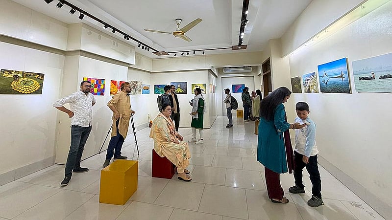 Visitors tour the photography exhibition titled “Love and Life Through My Eyes” at Dhaka’s Bishwo Shahitto Kendro (BSK).