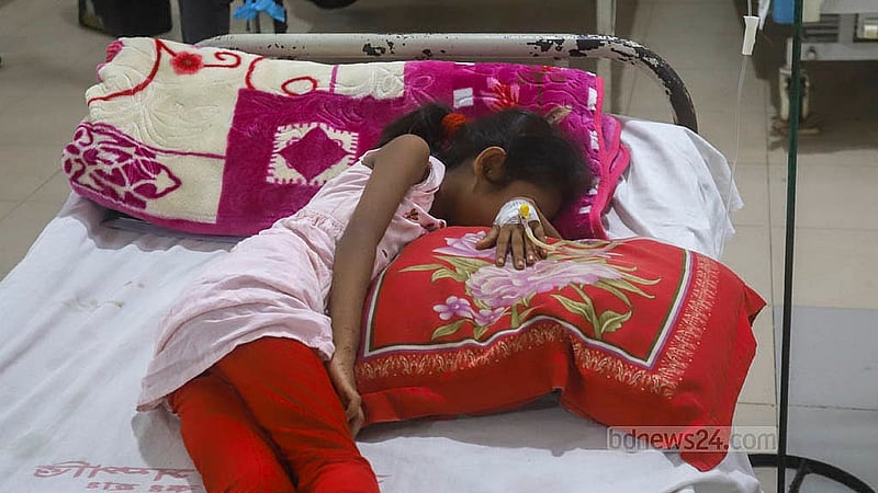 A child diagnosed with dengue lies in the children’s ward of Mugda General Hospital in Dhaka. Photo: Abdullah al Momin