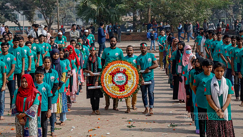 BD Clean volunteers pay homage at the Rayer Bazaar Massacre Memorial on Martyred Intellectuals Day. Photo: Mahmud Zaman Ovi