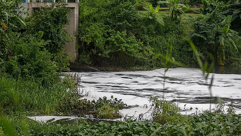 During the monsoon, waste from factories in Mirpur mixes with the new water in the Turag. The addition of the black, chemical-laden factory water leads to foam forming on top of the river. Photo: Mahmud Zaman Ovi