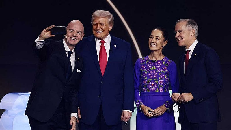 Football - FIFA World Cup 2026 - FIFA World Cup 2026 Draw - John F. Kennedy Center for the Performing Arts, Washington, DC, US - December 5, 2025 FIFA President Gianni Infantino, U.S. President Donald Trump, Mexico's President Claudia Sheinbaum and Canada's Prime Minister Mark Carney pose for a selfie during the FIFA World Cup 2026 Draw REUTERS