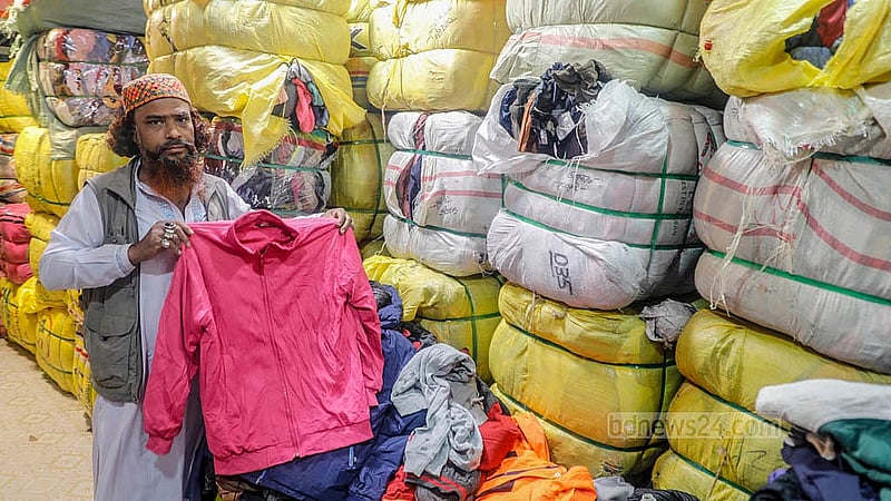 Different types of winter clothes and blankets are brought from China, Japan, South Korea, and Taiwan and put on display at the old clothes shops in Sadarghat. Each sack contains different types of clothes. Depending on the type, each sack sells for Tk 8,000 to Tk 30,000. Photo: Abdullah Al Momin