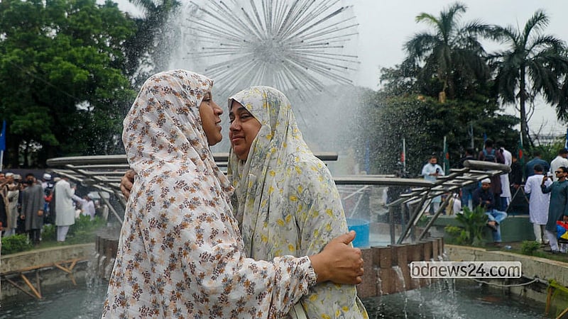 Devotees embrace after the Eid-ul-Fitr prayers at the National Eidgah on Saturday morning. Photo: Abdullah al Momin