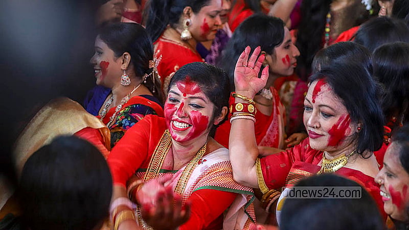 Hindu devotees sing and dance in joy at the Dhakeshwari Temple before the immersion of the idols of Goddess Durga on Sunday, Oct 13, 2024.. Photo: Abdullah al Momin