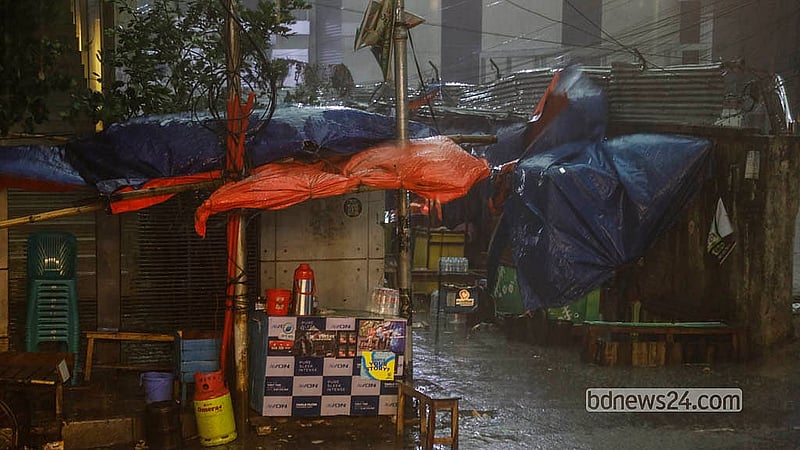 After enduring intense heat for days in the Bengali summer month of Baishakh, Dhaka residents get some respite from the rain on Sunday, Apr 26, 2026, though those outdoors face disruption due to wind and rain. Photo: Abdullah Al Momin