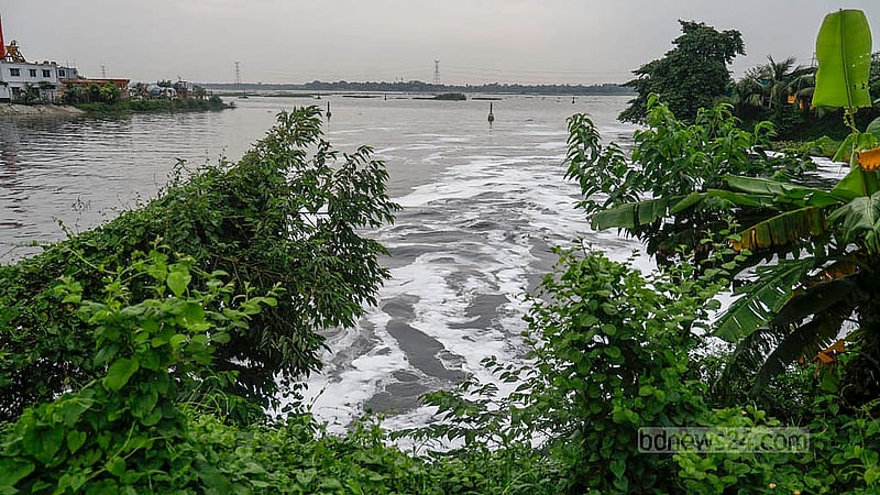 The black, chemical-laden water from the Mirpur factories takes time to mix with the river water. As more waste is dumped into the river, it changes the appearance of the water. Photo: Mahmud Zaman Ovi