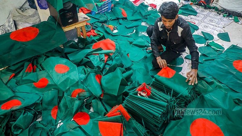 Freshly made flags are sorted by size at a factory in Kadamtali's Merajnagar.Photo: Abdullah Al Momin