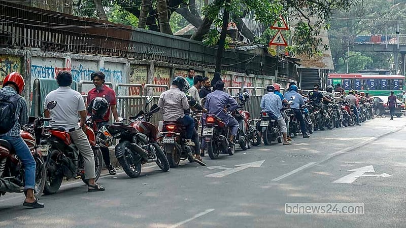 Motorcycles line up in long queues outside a filling station near Matsya Bhaban on Monday, Mar 23, 2026. Photo: Abdullah Al Momin