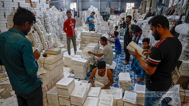 Workers are busy printing secondary school books at a printing house in Dhaka’s Matuail. Photo: Mahmud Zaman Ovi