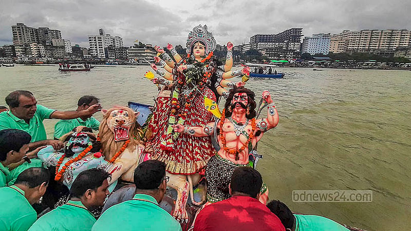 The followers of the Sanatan religion bid farewell to Goddess Durga by immersing her idol in the Buriganga River at Waizghat in Dhaka on Thursday, Oct 2, 2025. Photo: Abdullah Al Momin