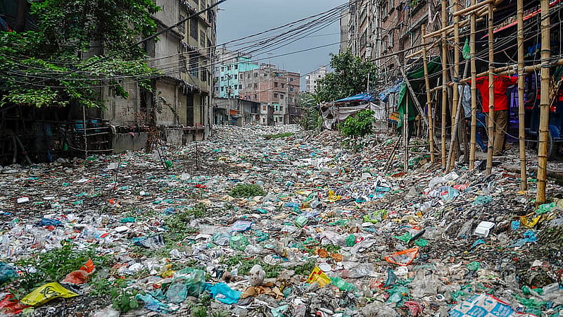 In South Keraniganj’s Shubhadda Canal, the plastic waste is piled on so thick that people can easily walk across it. Photo: Mahmud Zaman Ovi