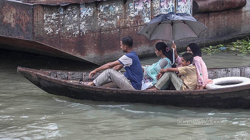 The Buriganga is filled with rainwater on Saturday, Aug 23, 2025, making boating more comfortable than before. However, when the water level drops, people must cross the river while covering their noses due to the foul smell from pollution. Photo: Abdullah Al Momin