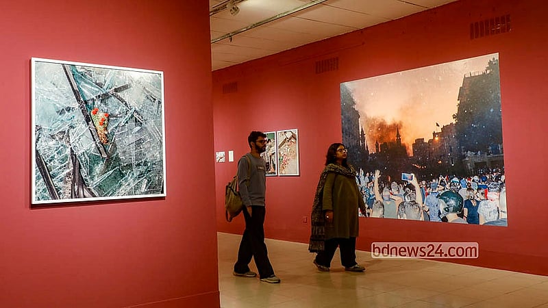 Visitors explore exhibitions at the international photography festival Chobi Mela at the National Art Gallery Auditorium of the Bangladesh Shilpakala Academy. Photo: Abdullah al Momin