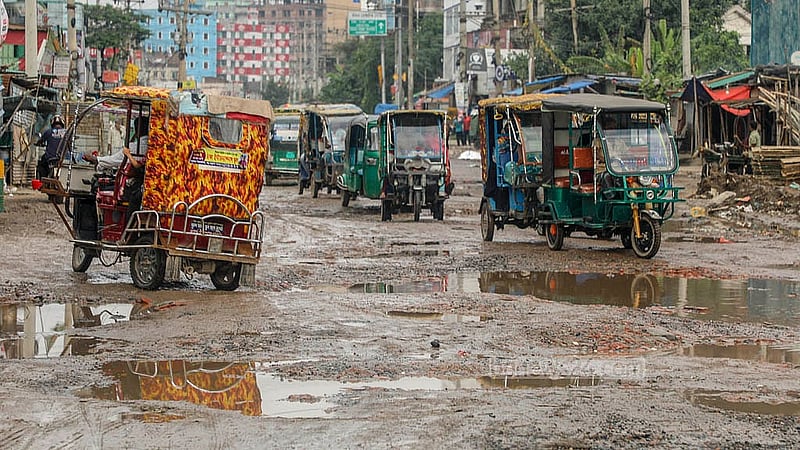 Rainwater pools in the potholes along the road from Hasnabad to Pangaon Container Terminal, creating hazards for drivers of all vehicles. Photo: Abdullah Al Momin