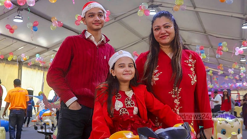 Many people attend the Christmas celebrations at the Pan Pacific Sonargaon Hotel in Dhaka with their children. Photo: Abdullah al Momin