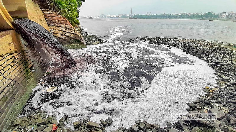 Industrial waste from nearby factories continually flows into the Buriganga River, causing it to remain polluted for most of the year.  Photo: Abdullah Al Momin