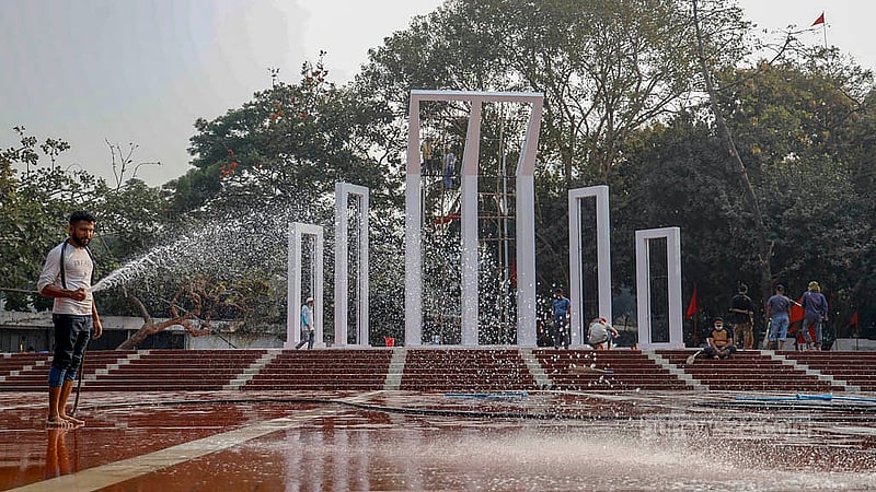 The pedestal of the Central Shaheed Minar, often left unattended, is now meticulously cleaned to ensure it is spotless for tributes to the martyrs on International Mother Language Day. Photo: Mahmud Zaman Ovi