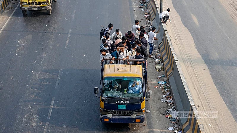 People board any vehicle they can find to return home for the voting holiday due to the lack of buses at the Gabtoli Bus Terminal on Tuesday, Feb 10, 2026. Photo: Mahmud Zaman Ovi
