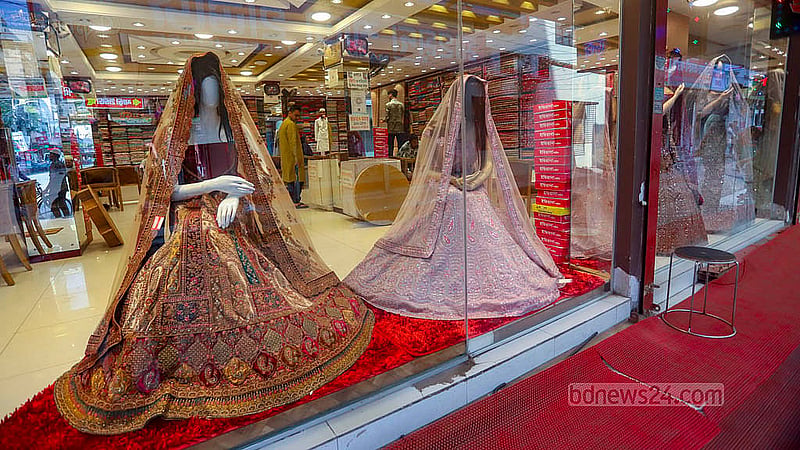 Stores display dresses of many different designs at Benarasi Palli in Dhaka’s Mirpur. Photo: Abdullah al Momin