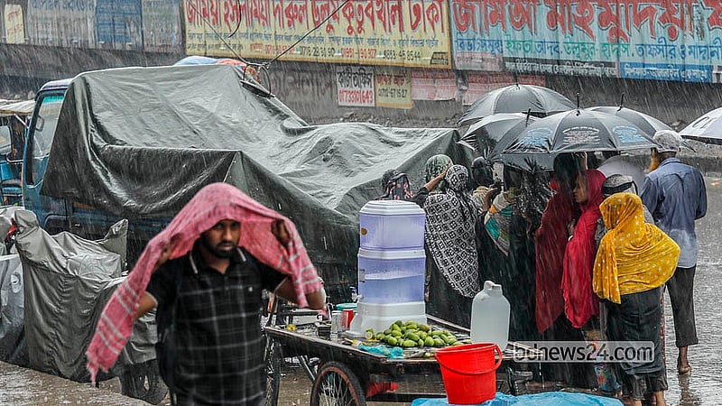 A TCB truck loaded with goods is covered during rain in Dhaka’s Jatrabari on Monday, May 11, 2026. Photo: Abdullah Al Momin