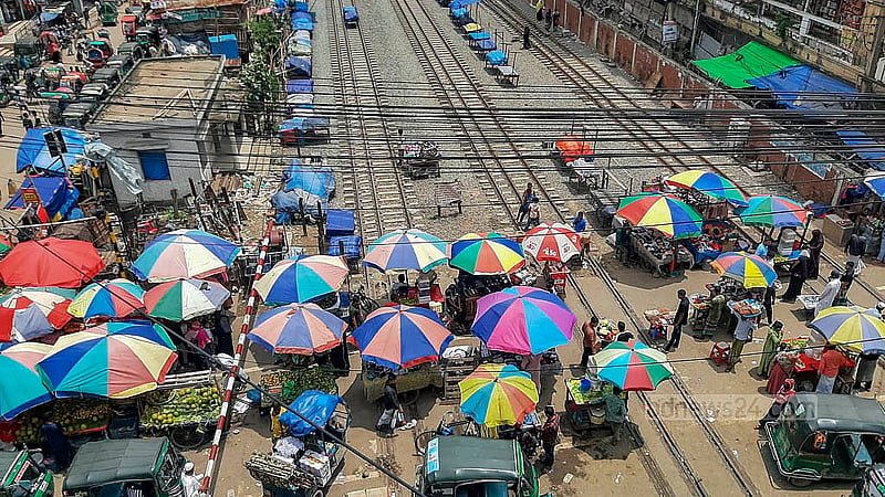 Defying the railway authorities’ ban, shops have been set up directly on the railway tracks in Dhaka’s Jurain. Photo: Abdullah al Momin