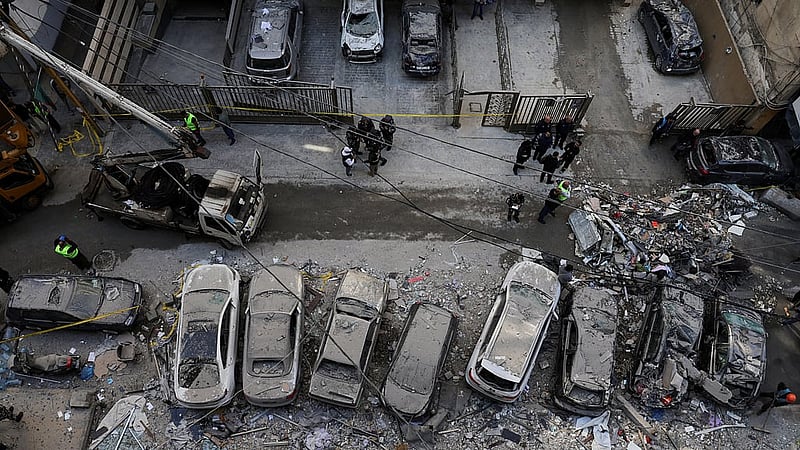 Debris and damaged vehicles at the site of an Israeli strike on an apartment building, in central Beirut, Lebanon, Mar 11, 2026, following an escalation between Hezbollah and Israel amid the US-Israeli conflict with Iran. REUTERS/Emilie Madi