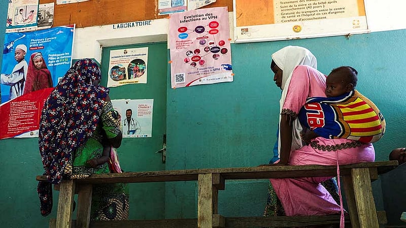 Women sit as they wait for medical consultation at a Health Center, in Bogo Cameroon Sept 2, 2025. REUTERS/Desire Danga Essigue