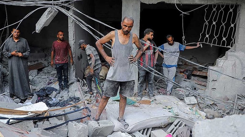 A Palestinian man looks on as he inspects the site of Israeli strikes on houses at Shati (Beach) refugee camp, amid an Israeli military operation, in Gaza City Sept 23, 2025. REUTERS