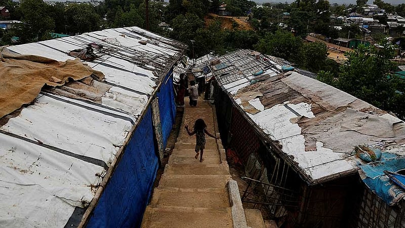 A Rohingya refugee child runs down the stairs of a refugee camp in Cox's Bazar, Bangladesh, Aug 27, 2025. REUTERS/Mohammad Ponir Hossain
