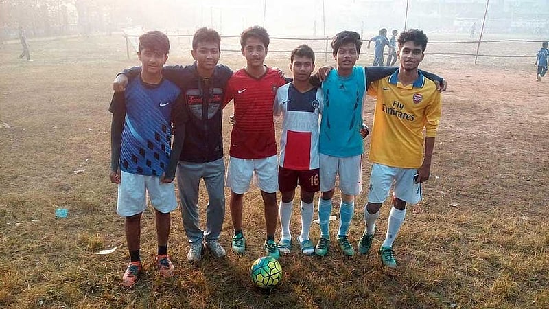 Mughdha loved to play. In one photo, he stands among his friends, wearing a red T-shirt.