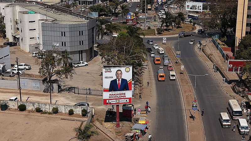 A drone view shows a campaign billboard for Zambian President Hakainde Hichilema, ahead of the country's general election on Aug 13, along a road in central Lusaka, Zambia, Aug 8, 2026. REUTERS/Moses Mwape