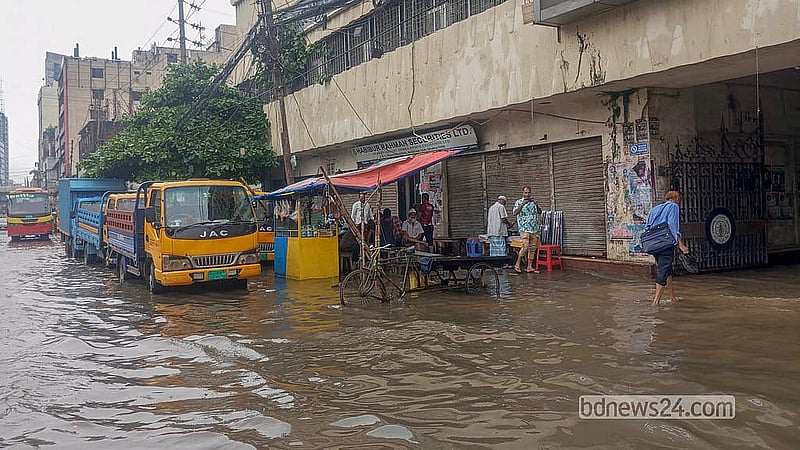 Rainwater inundates the road outside the Bangladesh Water Development Board office in Motijheel on Sunday, Jul 12, 2026.  Photo: Abdullah Al Momin