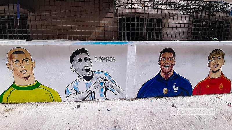 Murals of popular footballers are displayed along “FIFA Goli” on RK Mission Road in Dhaka’s Tikatuli before the FIFA World Cup. Photo: Abdullah Al Momin