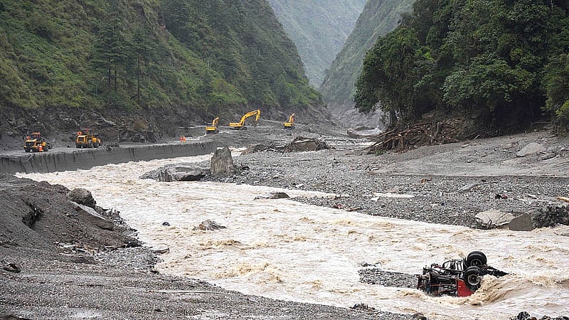 Excavators and loaders in action as rescue workers repair a road leading to Gyirong Port after a mudslide, in Gyirong county, Shigatse, Tibet Autonomous Region, China Aug 28, 2026. cnsphoto via REUTERS