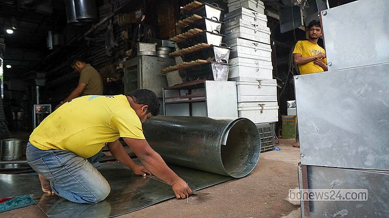 Though demand has fallen sharply, a handful of workshops in Dhaka's Karwan Bazar continue producing traditional tin trunks.  Photo: Shamsul Hoque Ripon