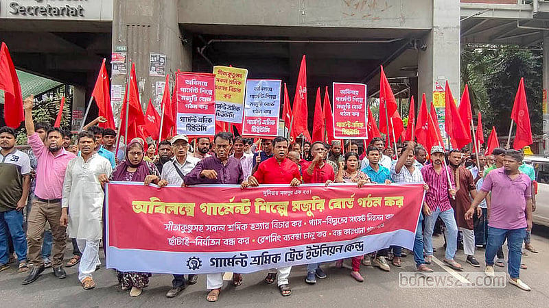 Members of the Garment Workers’ Trade Union Centre march outside the Jatiya Press Club on Friday, Aug 28, 2026, demanding a wage board for the garment industry.