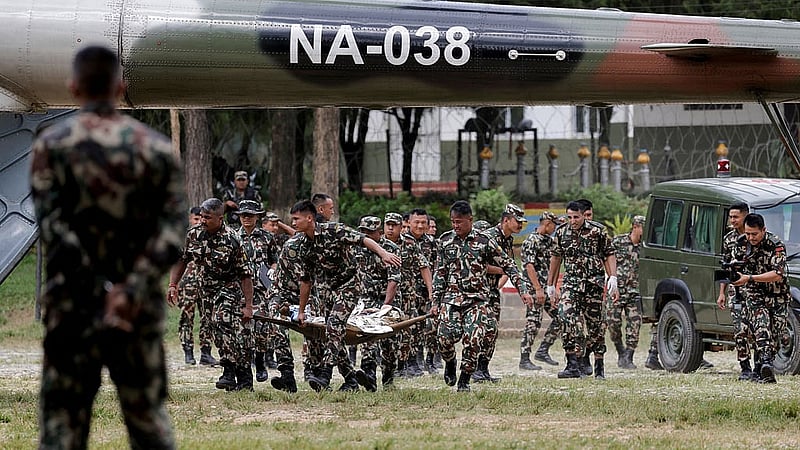 Members of the Nepali Army carry a survivor who is being airlifted following a flash flood at Trishuli in Nuwakot district, Nepal, Aug 26, 2026. REUTERS/Navesh Chitrakar