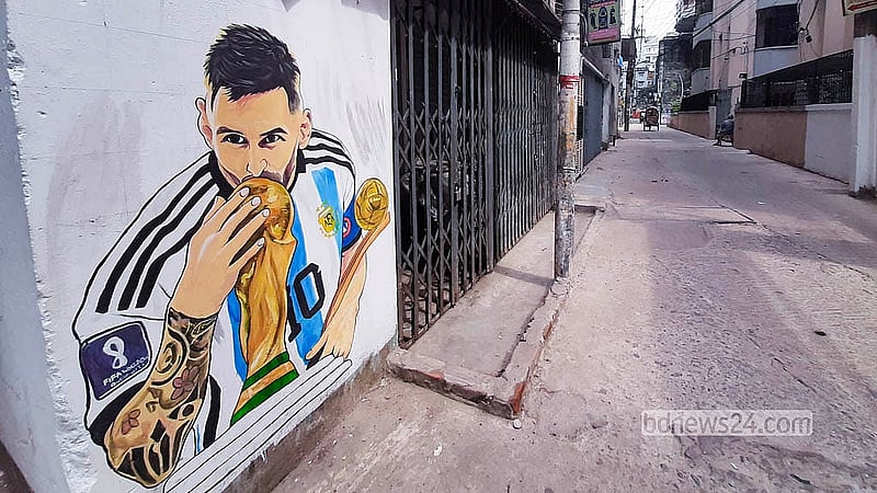 A mural of Lionel Messi is painted on a wall at Tikatuli’s RK Mission Road. Photo: Abdullah Al Momin