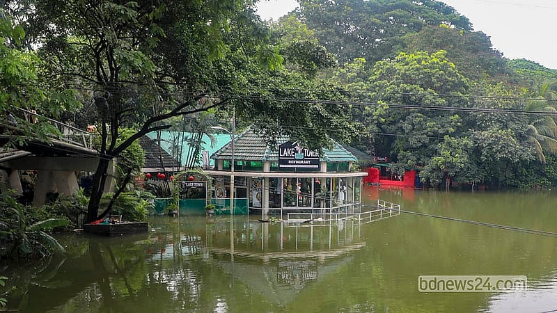 Continuous rain has left several structures around Dhanmondi Lake under water.  Photo: Abdullah Al Momin