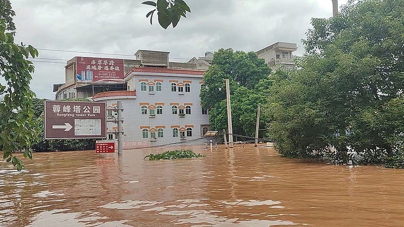 Floodwaters inundate a street after heavy rainfall brought by typhoon Narra caused flooding in Chongzuo, Guangxi Region, China, in this screengrab obtained from a social media video released on Aug 24, 2026. Photo: Reuters