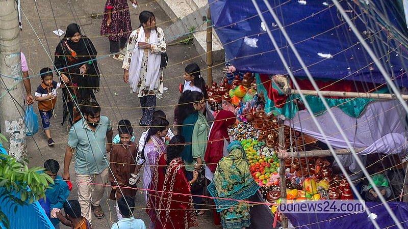 A fair is organised around the boat race at Nawabbari Pond in Old Dhaka’s Islampur. Photo: Abdullah Al Momin