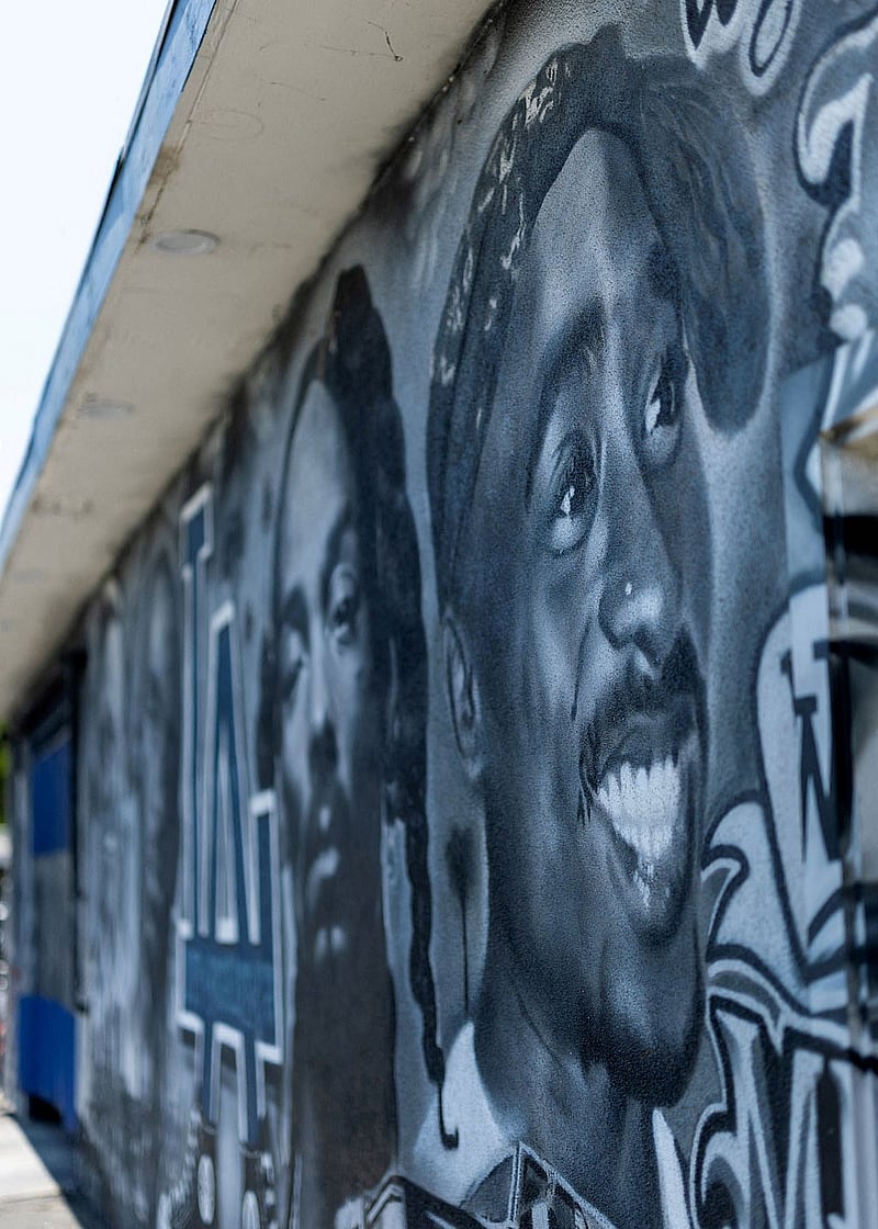 A mural depicting late rapper Tupac Shakur on the side of a building in Bellflower California, during the opening day of the trial for Duane Davis, who is charged for his alleged role in leading a group of men to kill Shakur in a 1996 drive-by shooting near the Las Vegas Strip, US, Aug 10, 2026. REUTERS
