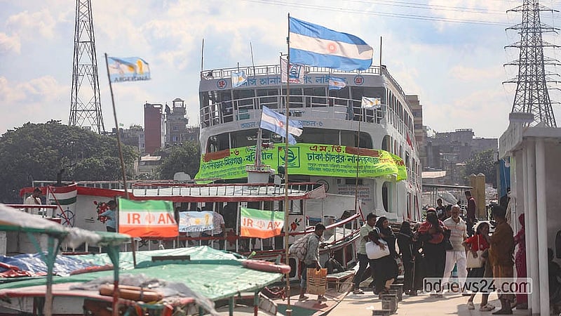 Football fever has reached the waterways, with everything from small wooden boats to passenger launches flying the colours of World Cup nations. Photo: Abdullah Al Momin
