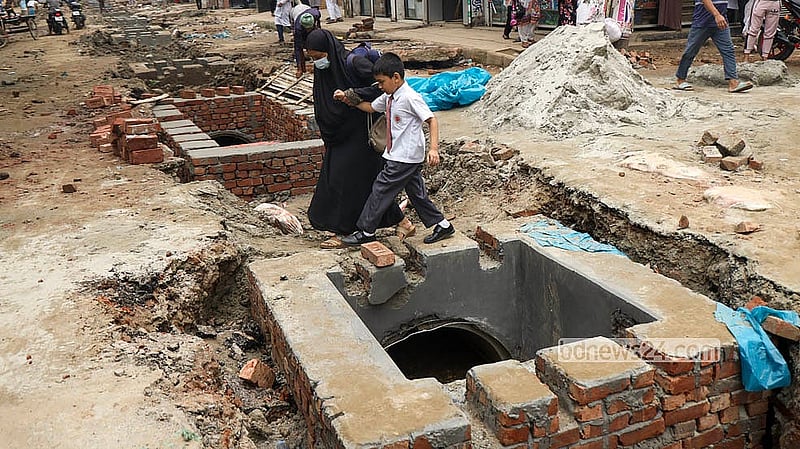 For students in South Basabo, navigating the dug-up Khilgaon-Basabo road has become a daily ordeal.   Photo: Shamsul Haque Ripon