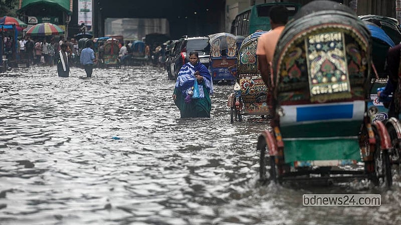 Knee-deep floodwater engulfs a road in Motijheel after persistent rain on Sunday, Jul 12, 2026.  Photo: Abdullah Al Momin