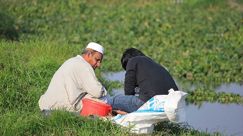 Prof Shahjahan collects samples for research (left). File photo