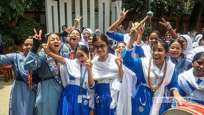Students of Motijheel Ideal School and College throw up joyful victory signs after passing their SSC exams. Photo: Abdullah Al Momin