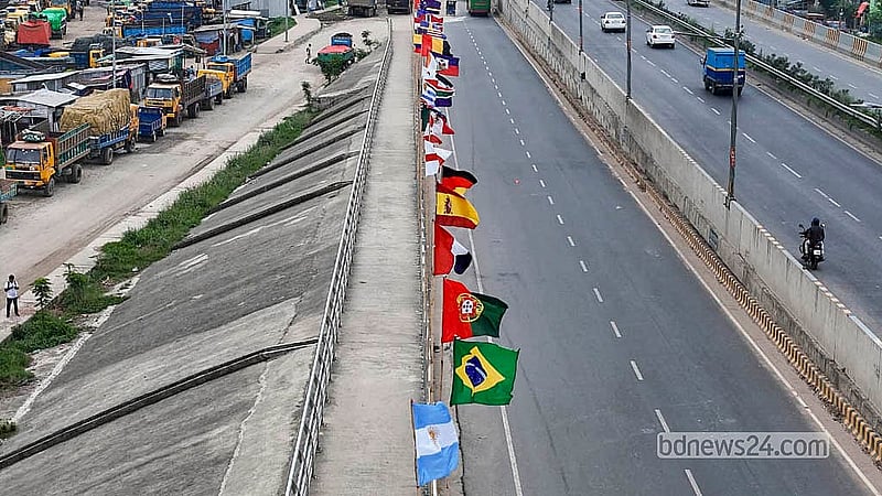 The flags of all 48 World Cup nations line Gabtoli Bridge, bringing the global tournament to one of Dhaka's busiest gateways. Photo: Abdullah Al Momin