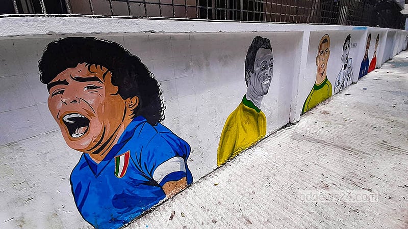 Murals of popular footballers are displayed along “FIFA Goli” on RK Mission Road in Dhaka’s Tikatuli before the FIFA World Cup. Photo: Abdullah Al Momin